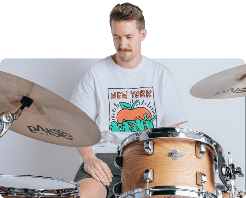 Drummer practicing at a kit